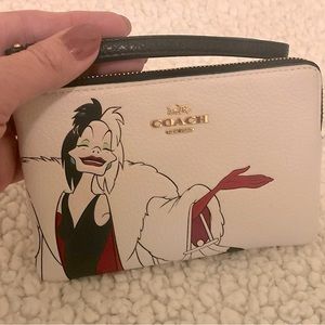 Disney X Coach Corner Zip Wristlet With Cruella Motif